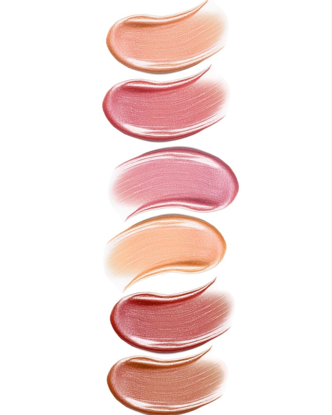 Five swatches of different lip gloss shades on a white background